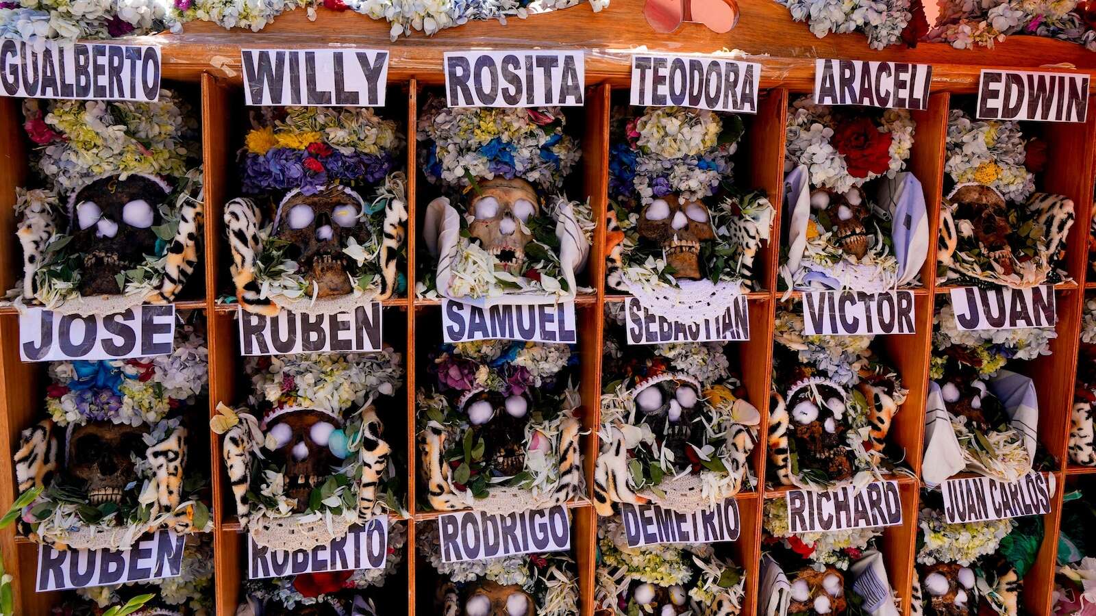 Bolivians carry adorned human skulls asking for favors in the Ñatitas festival in La Paz