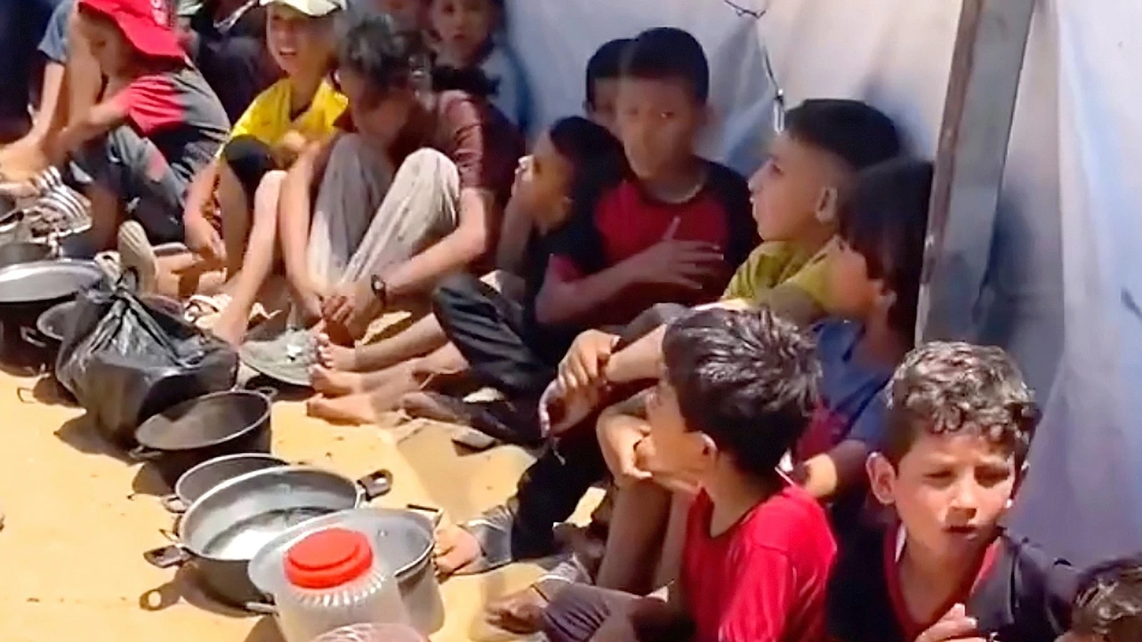 Gazan children wait for food in long lines as starvation looms