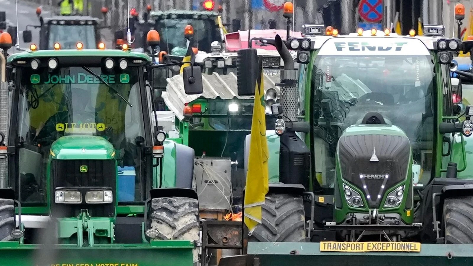 With blaring horns rumbling engines, farmers in tractors block Brussels to protest EU policies
