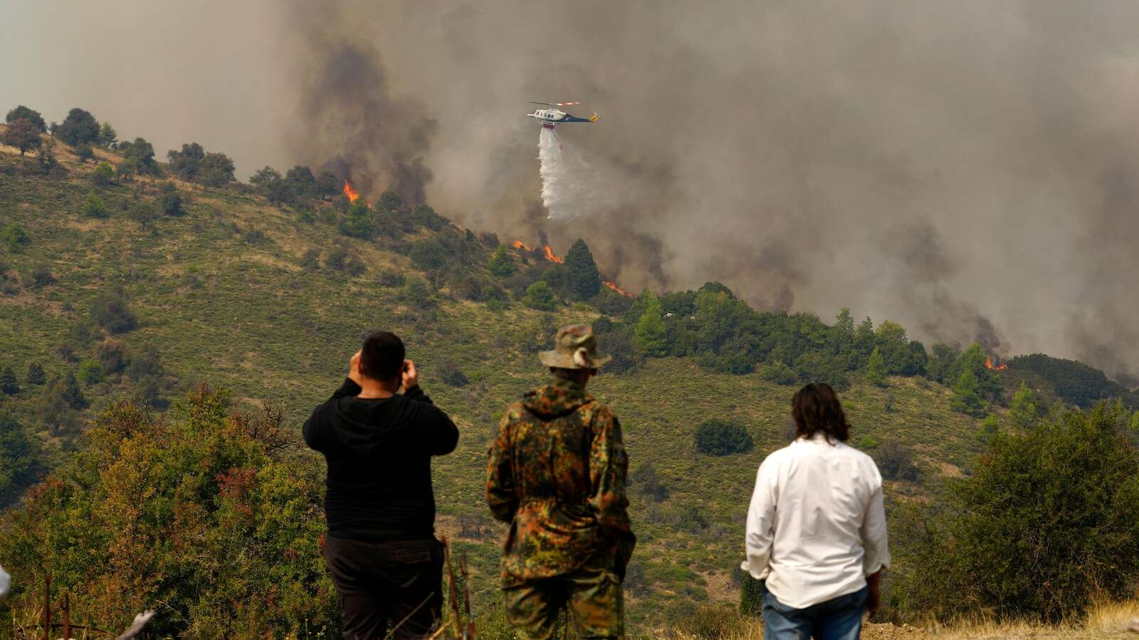 Hundreds of firefighters battle a deadly forest fire raging in southern Greece for the third day