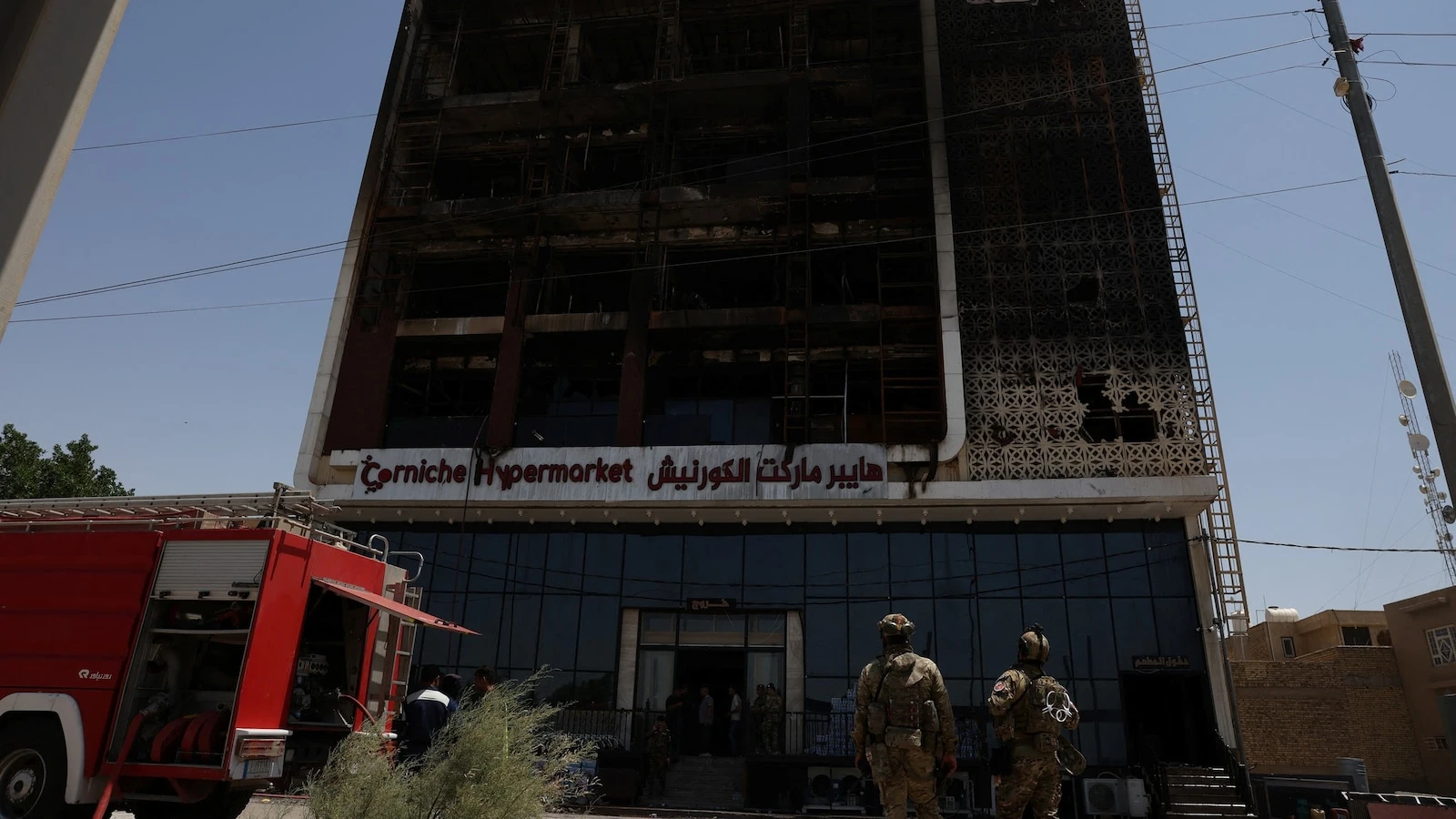 Dozens feared dead after fire rips through shopping mall in Iraq