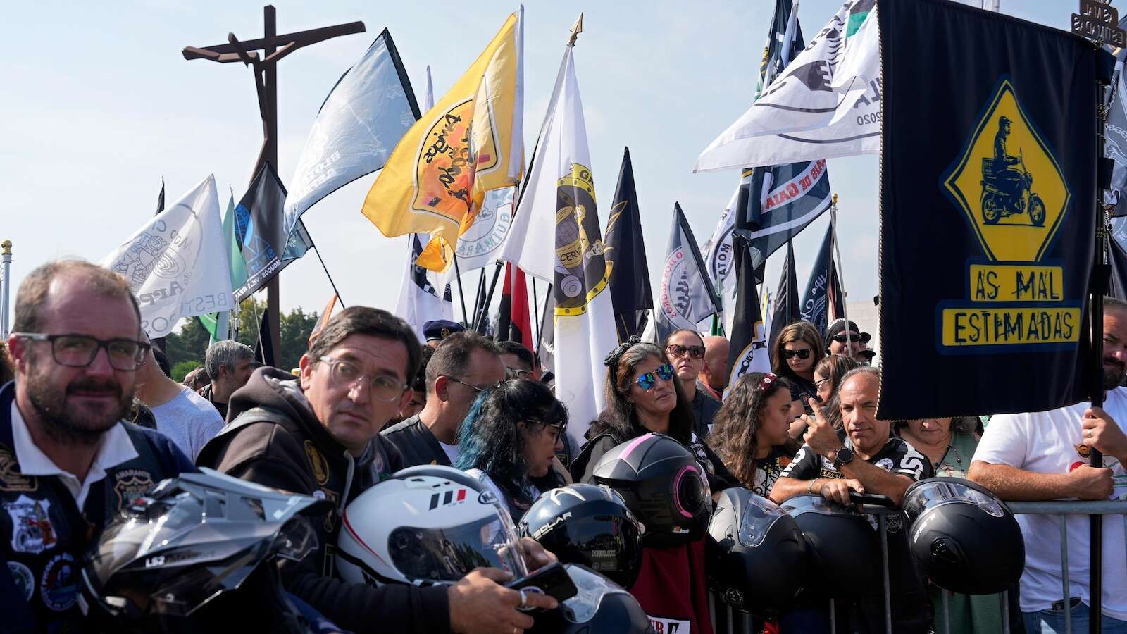 An estimated 180,000 motorcyclists converge at Portuguese shrine to have their helmets blessed.