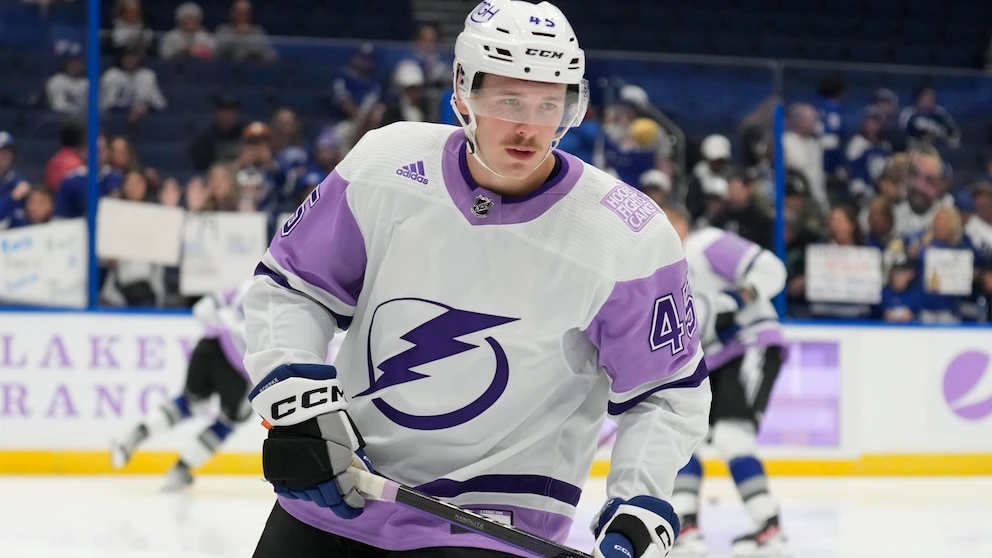 Lightning left wing Cole Koepke wearing neck guard following the death of Adam Johnson