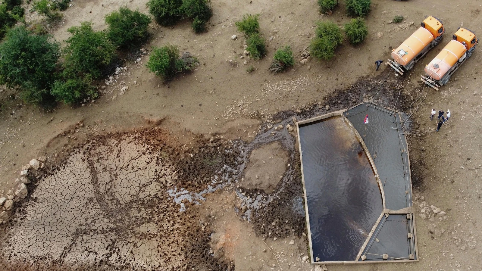 Water tanks replace springs on a Serbian mountain as drought endangers some 1,000 cows and horses