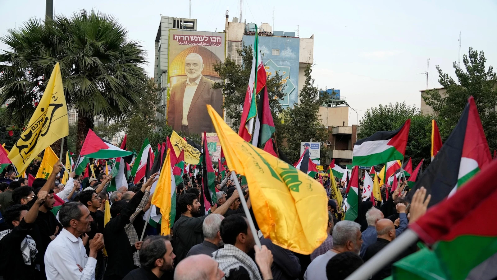Iran’s supreme leader prays over the coffin of Hamas leader Haniyeh, whose killing risks a wider war
