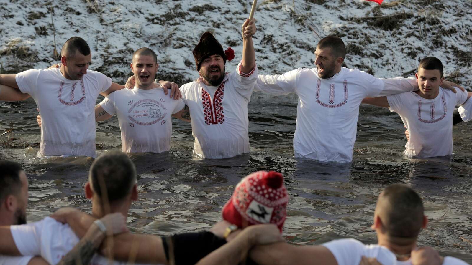 Bulgarians celebrate the feast of Epiphany with a ritual plunge into icy rivers