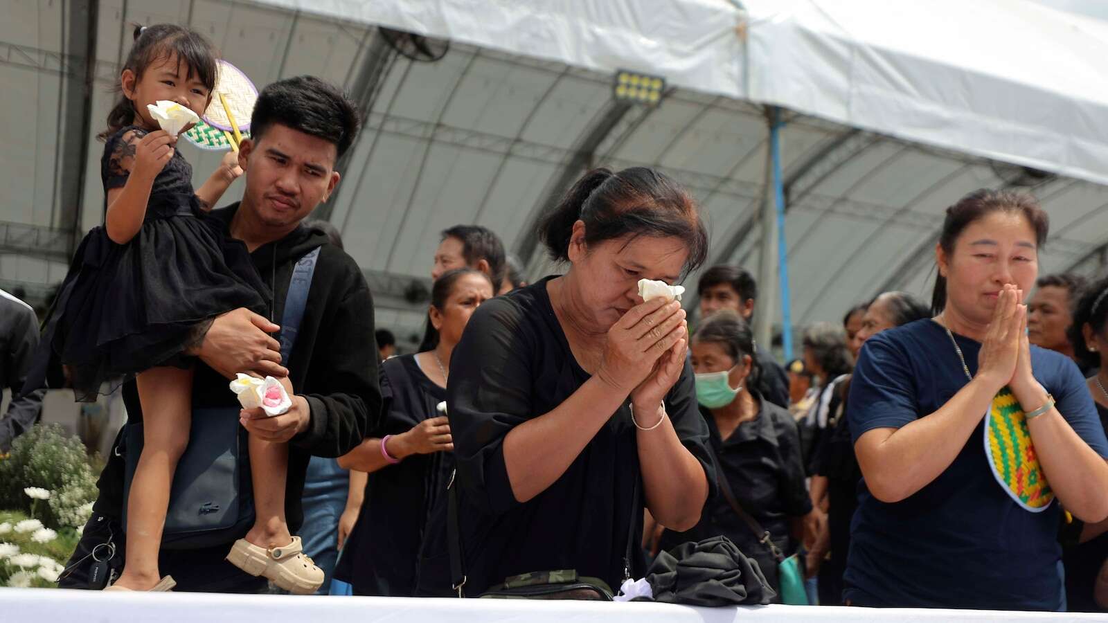 Small town in Thailand hold mass cremation for 23 who died in a school trip bus fire