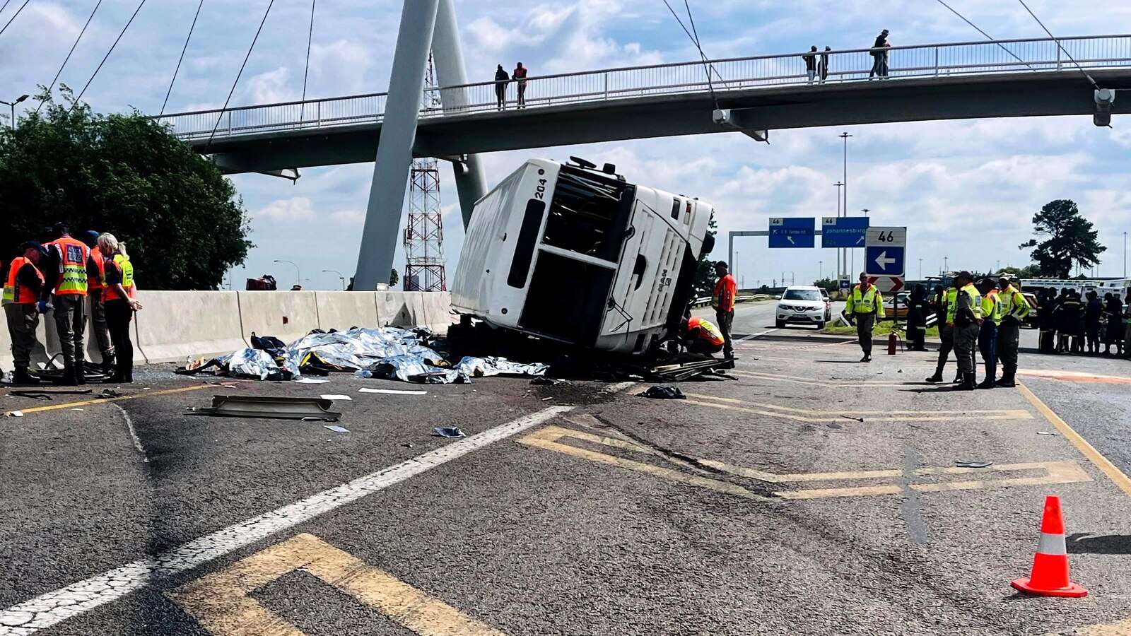 12 dead, dozens hurt as a bus overturns and passengers are thrown on a highway in South Africa