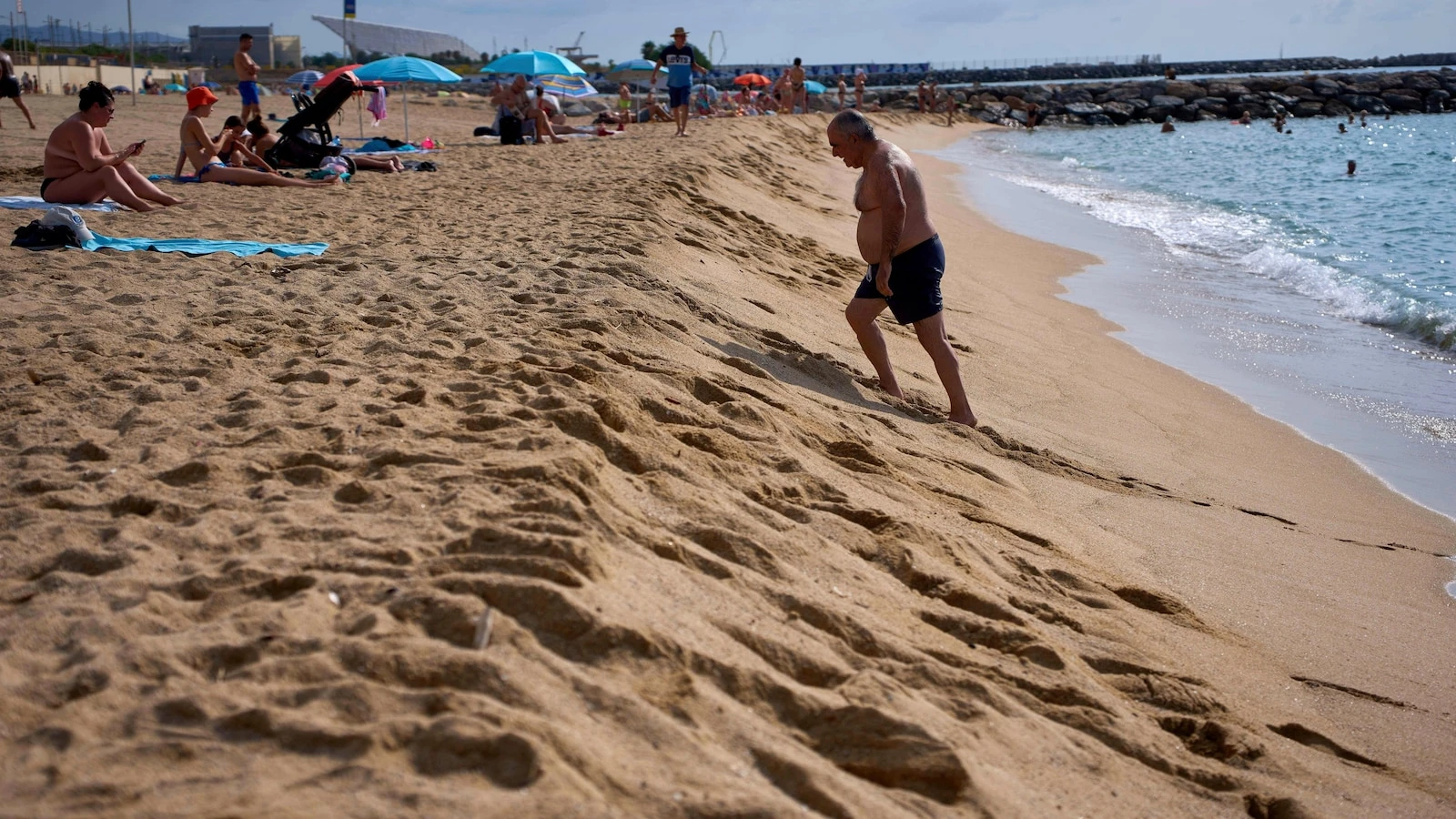 As Spaniards summer at Barcelona's beaches, some worry about the erosion of coastline