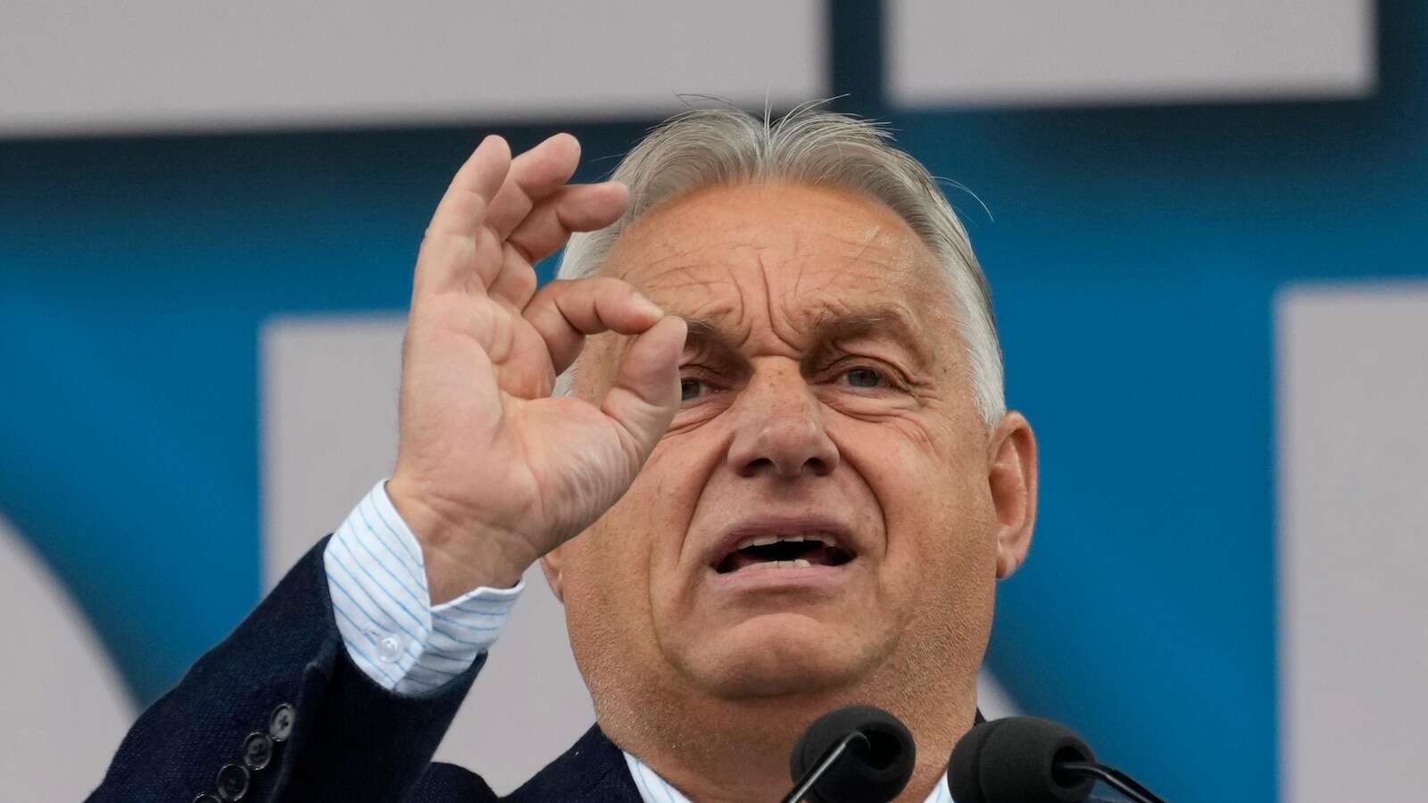 Hungary’s Orbán interrupted by activist during EU presidency news conference