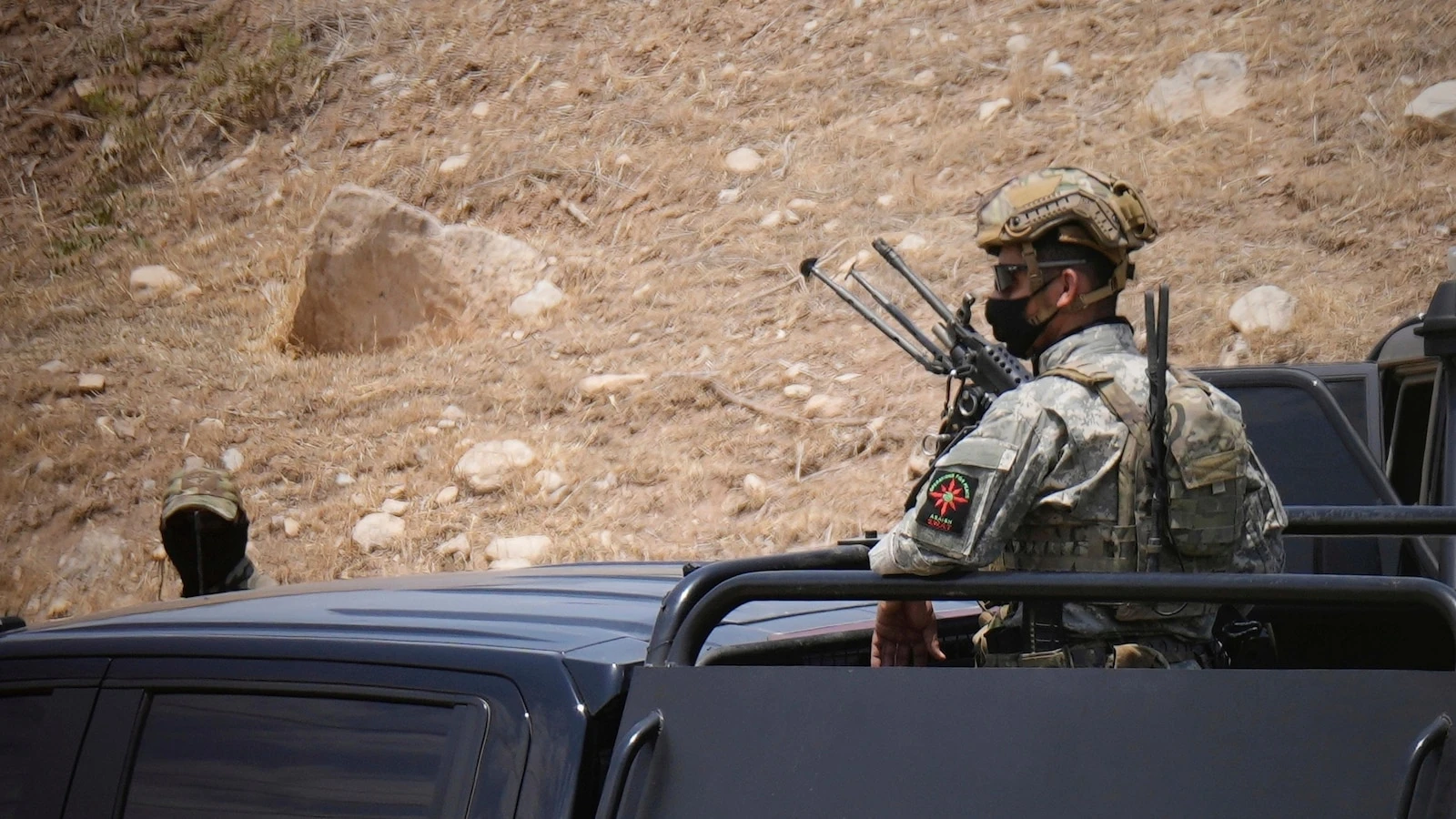 Kurdish separatist fighters in Iraq begin laying down weapons as part of peace deal