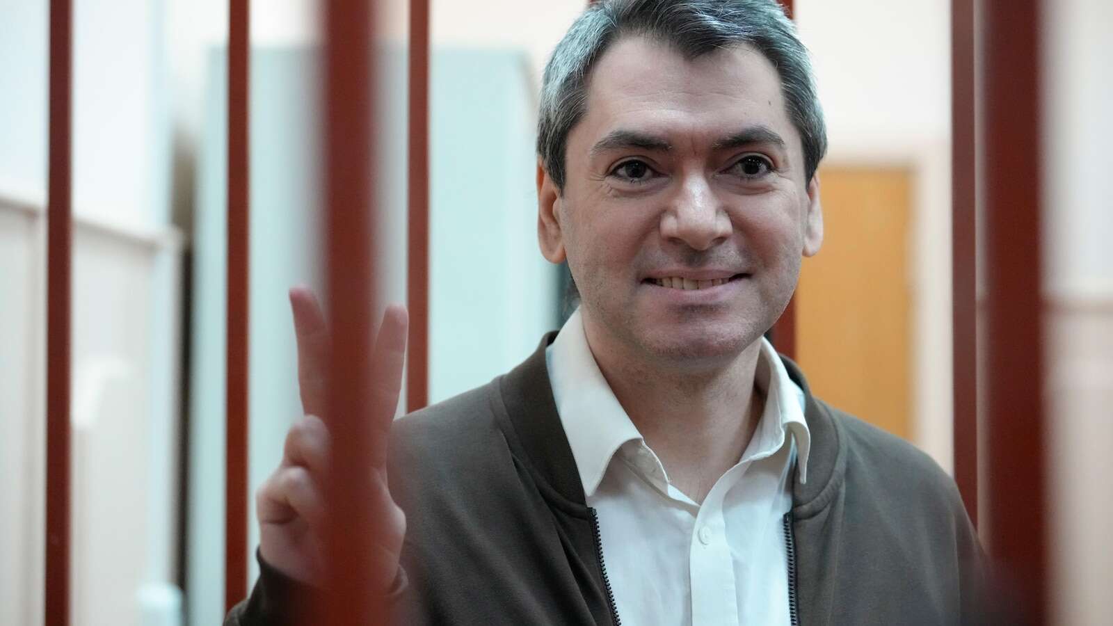 Jailed leader of a prominent election watchdog is on trial in Russia