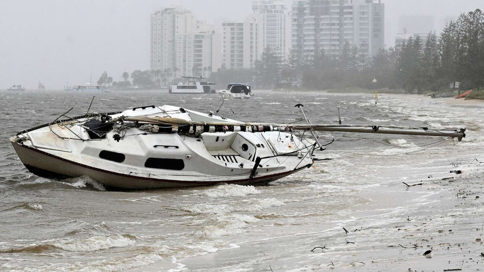 1 dead and several injured as tropical low tracks west across Australian east coast