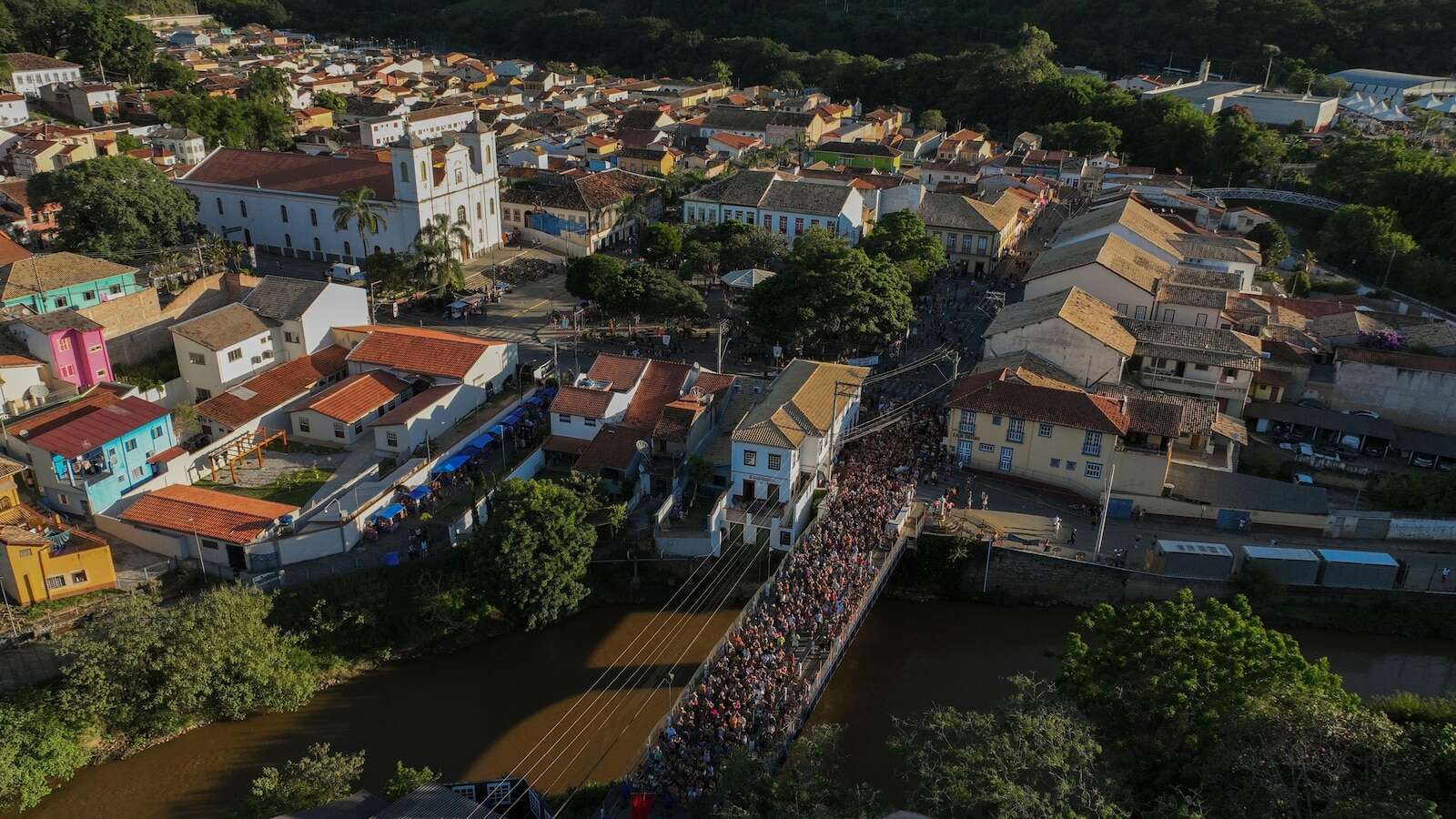 Families, revelers party side-by-side in traditional Carnival in Sao Paulo town