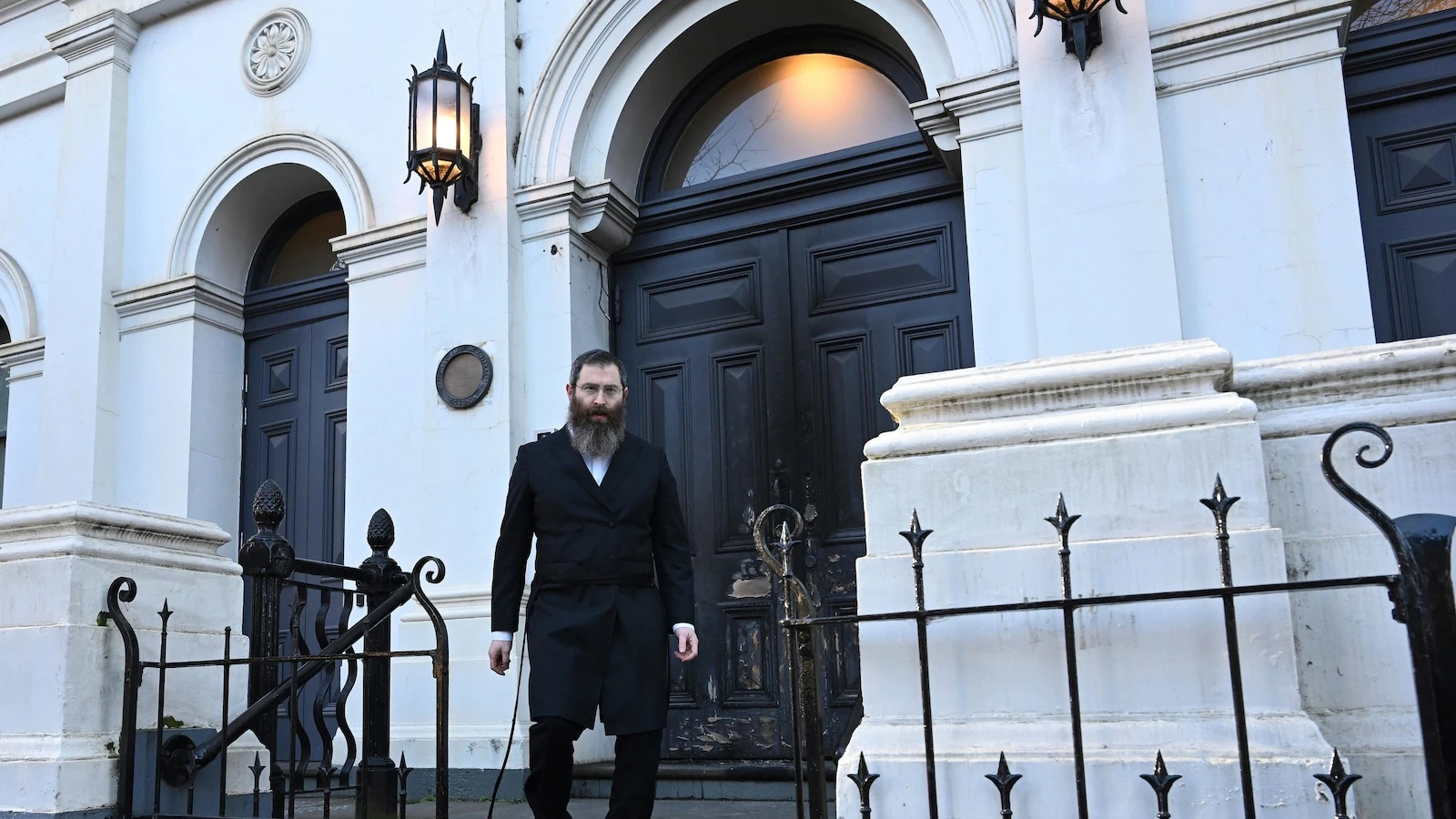 Congregation flees after arsonist sets fire to an Australian synagogue door