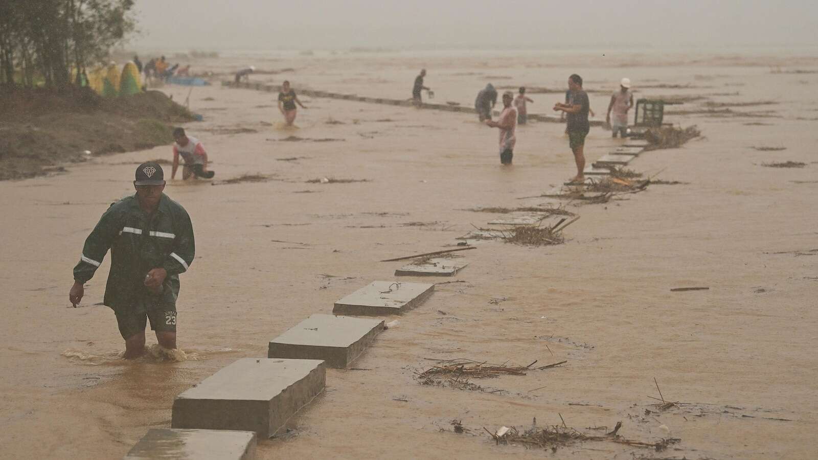 Typhoon batters storm-weary Philippines and displaces thousands more people as a new storm threatens