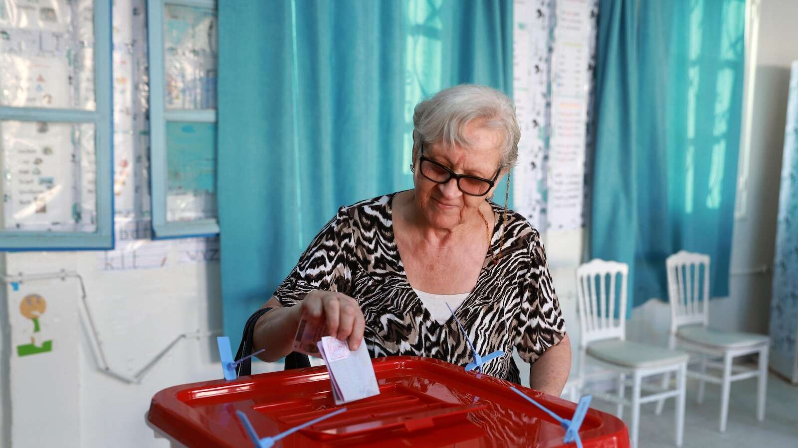 Tunisians vote in an election with one of President Saied's 2 challengers in prison