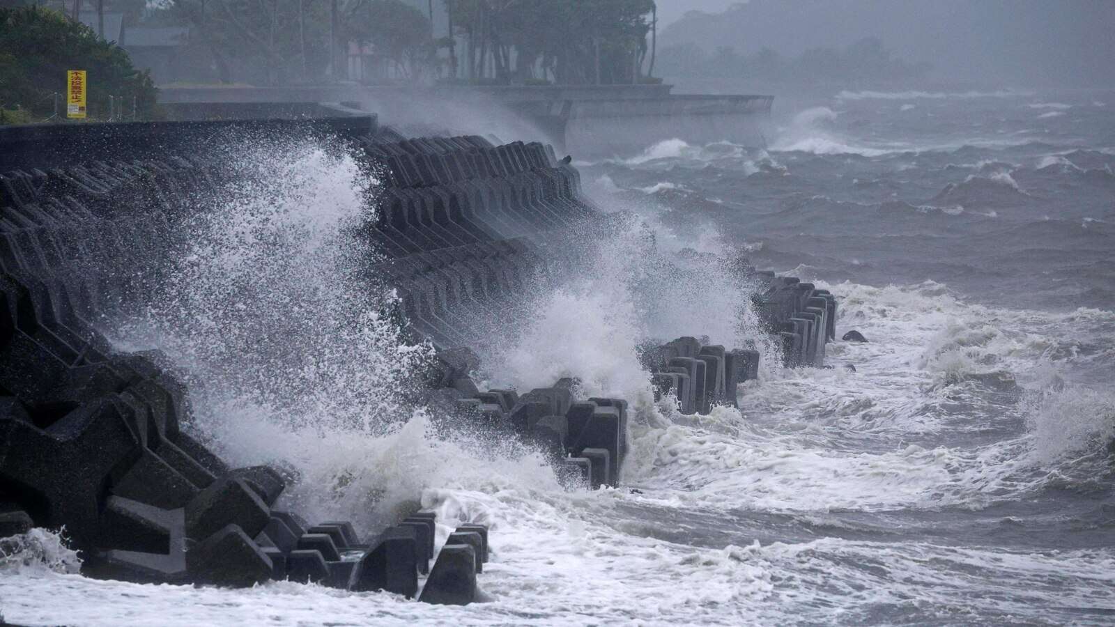 Typhoon lashes Japan with torrential rain and strong winds on a slow crawl north