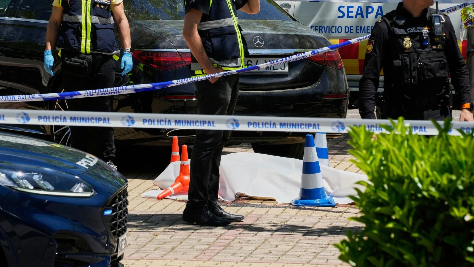 An adviser to an ex-Ukrainian president is killed near an American school in Spain, officials say