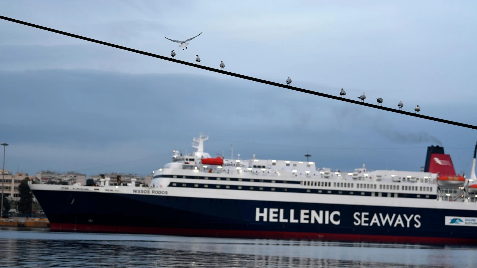 Strikes halt trains and ferries in Greece a year after the country's worst rail disaster