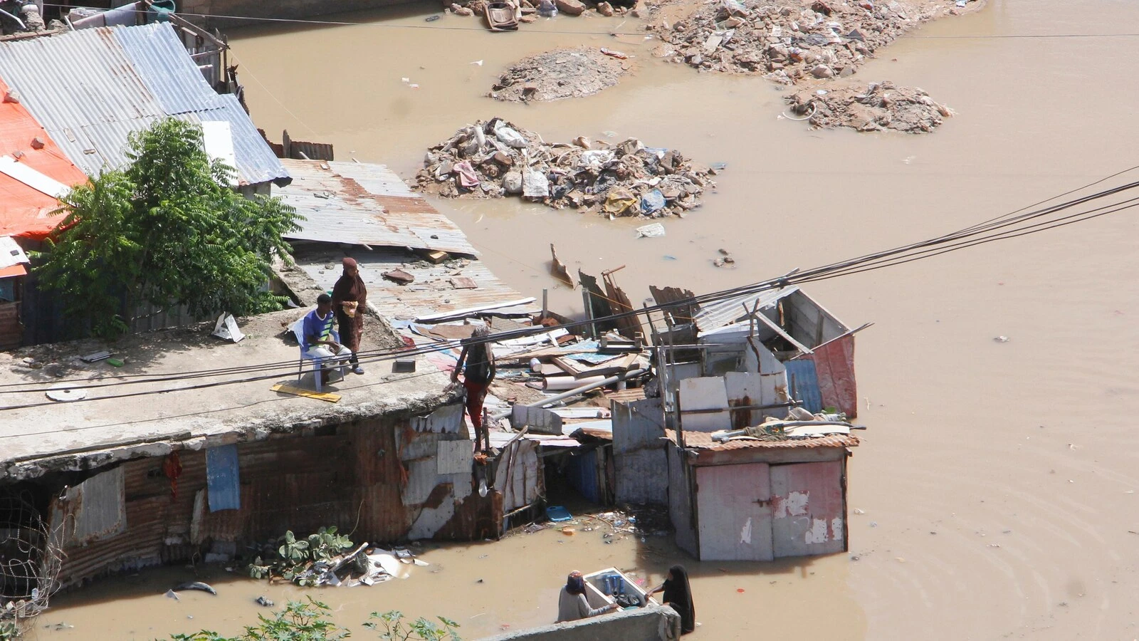 At least seven people die as heavy rains leave waist-high floodwaters in Somalia's capital