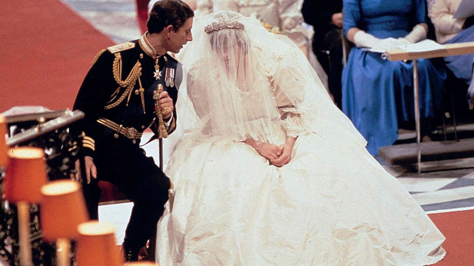 Designers of the late Princess Diana's wedding dress settle dispute over drawings of the gown