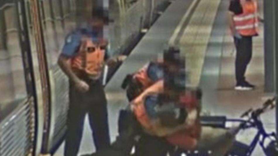 Wild moment cyclist tackled at station