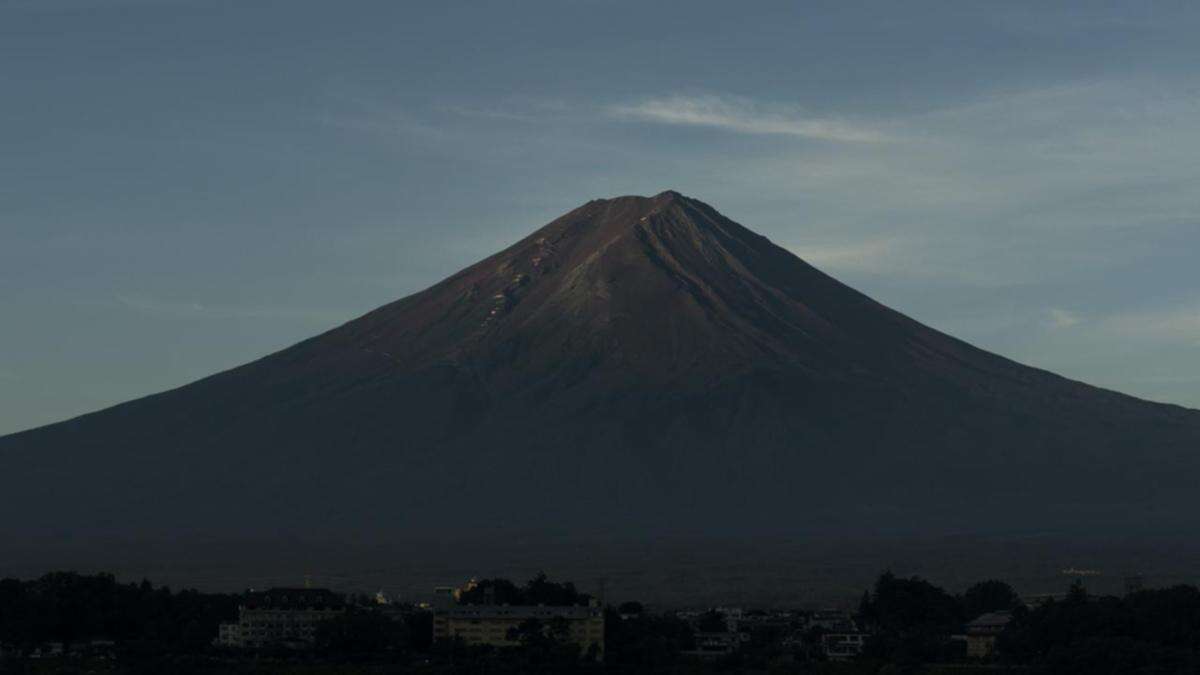 Snow falls on Mt Fuji after longest delay in 130 years