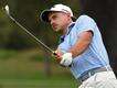 Svensson leads French Open, Micheluzzi six shots back