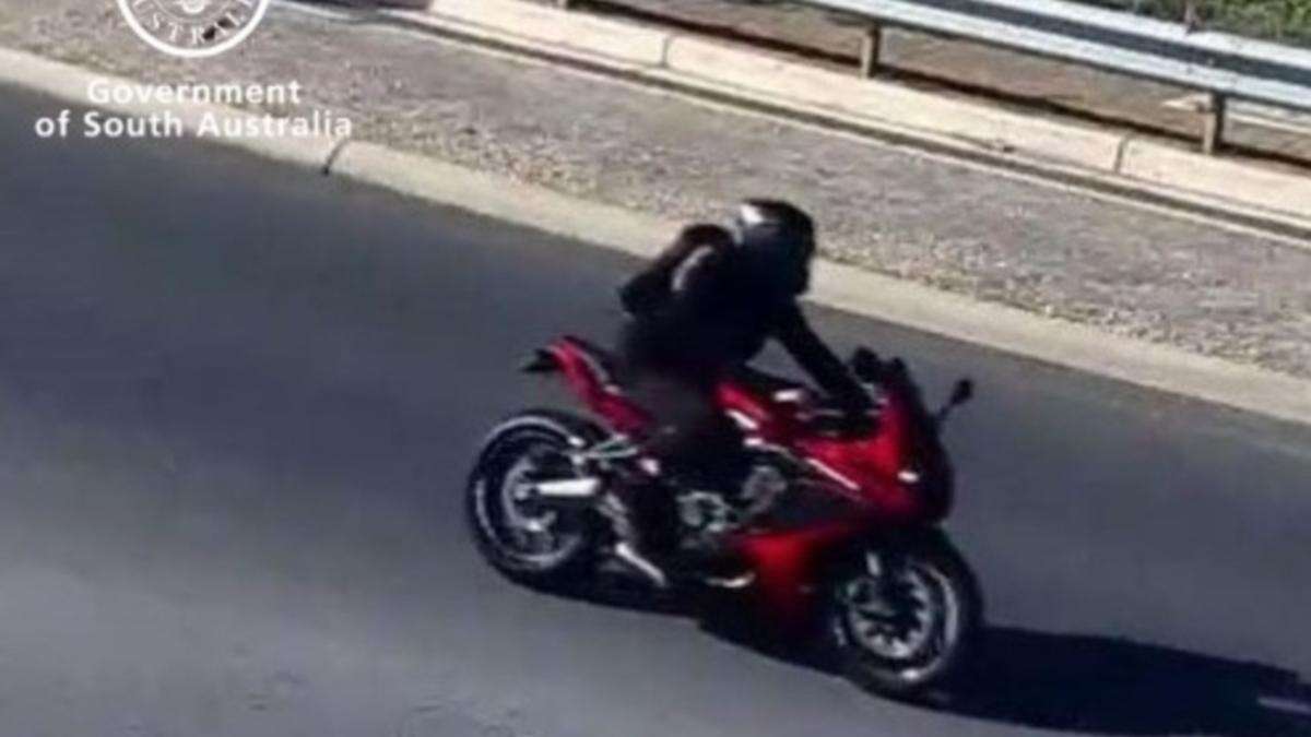 Cops hunt ‘red rider’ after fatal crash