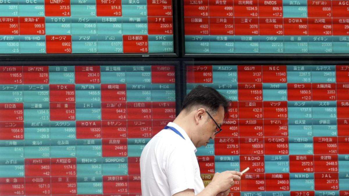 Asian shares fall after oil surges on Middle East risks