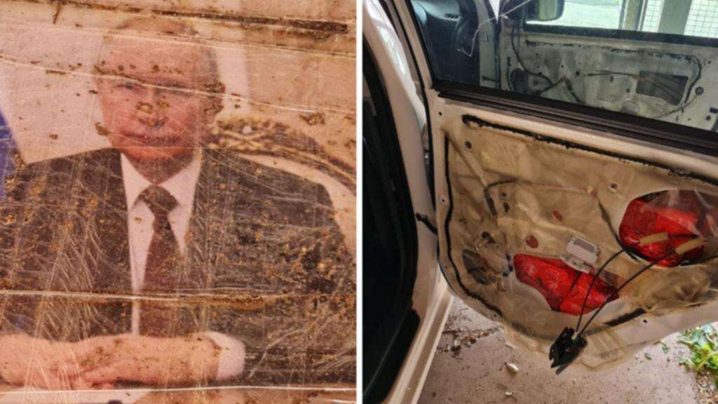 Cops’ bizarre Putin find in car door