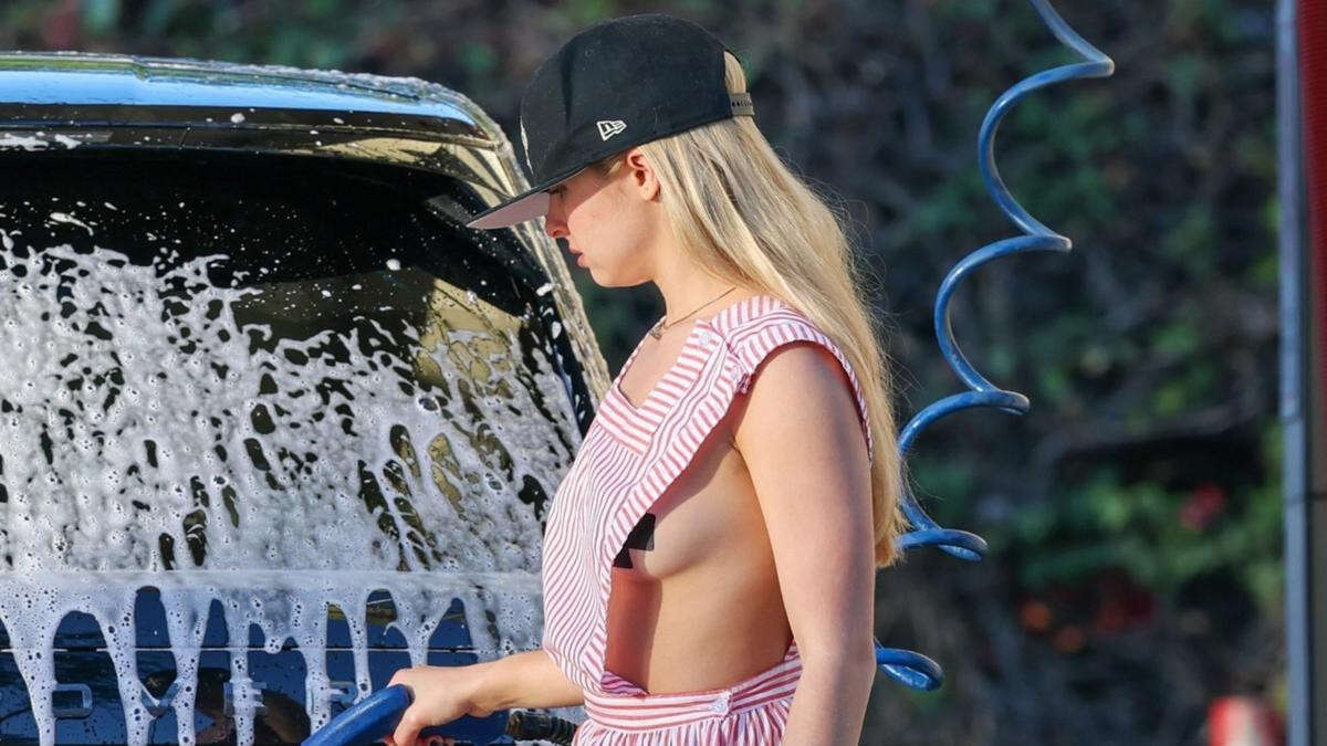 TikTokker turned popstar risks nip slip washing car braless