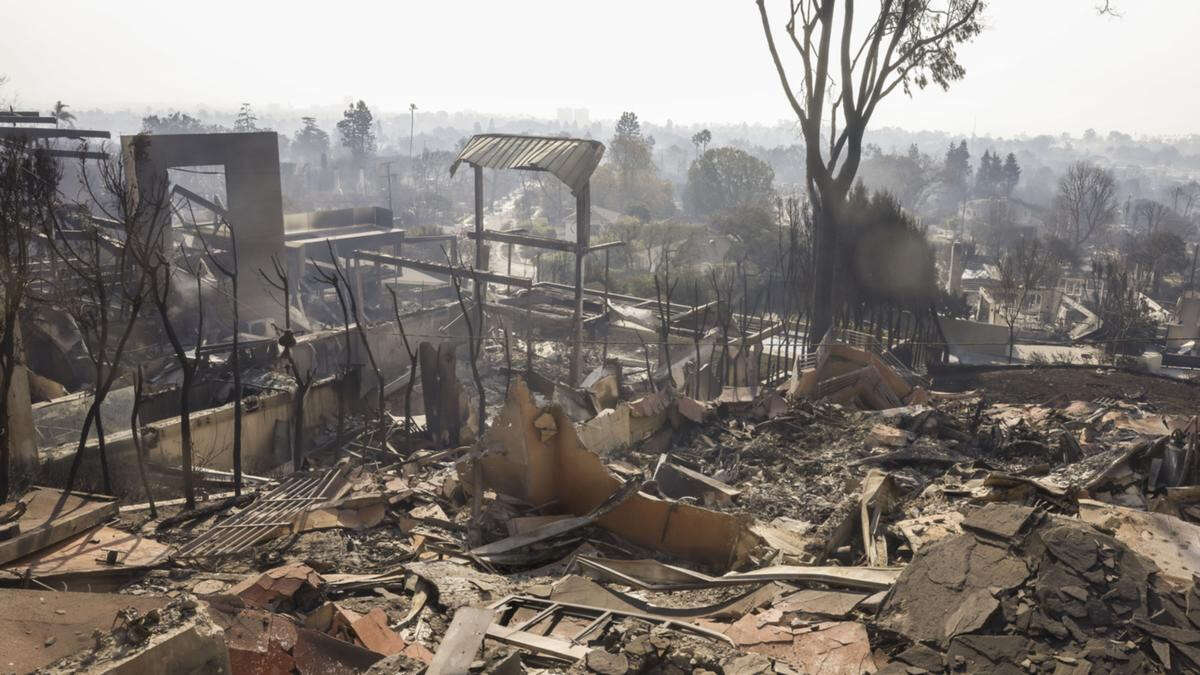 updatedDeath toll rises again as authorities sift through ashes