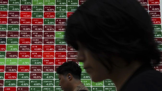 Stocks, dollar stay calm in Asia as oil rises
