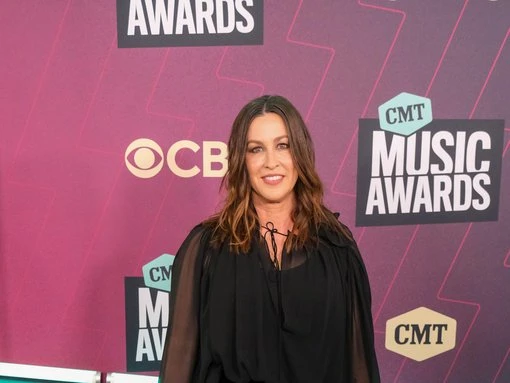Alanis Morissette given designer blouse by Madonna after turning up in sweat pants