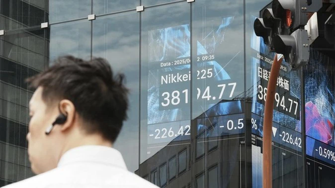 Stocks slide, oil and gold jump after Israel hits Iran