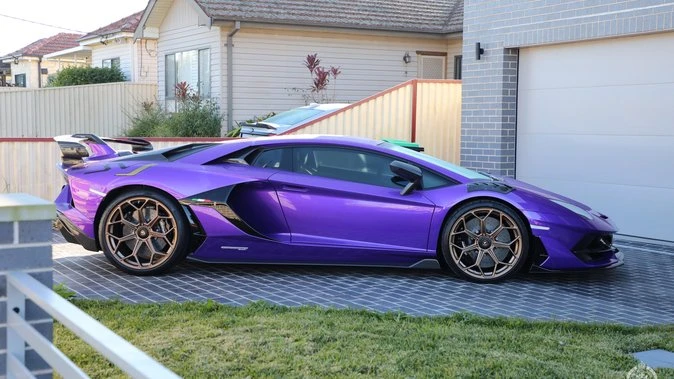 Lamborghinis, McLaren seized in NSW counterfeiting ring bust
