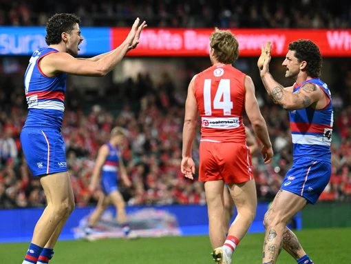 Dogs celebrate Bont milestone with tense win over Swans