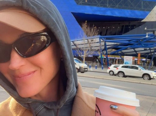 Katy Perry poses with fans at RAC Arena while incognito