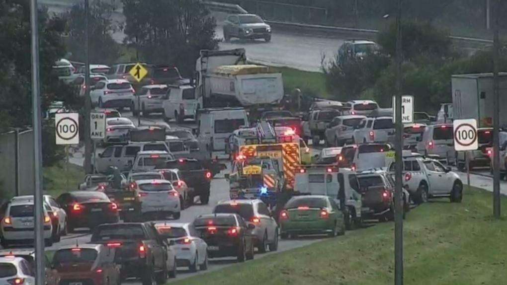 Cops divert traffic after car bursts into flames on highway