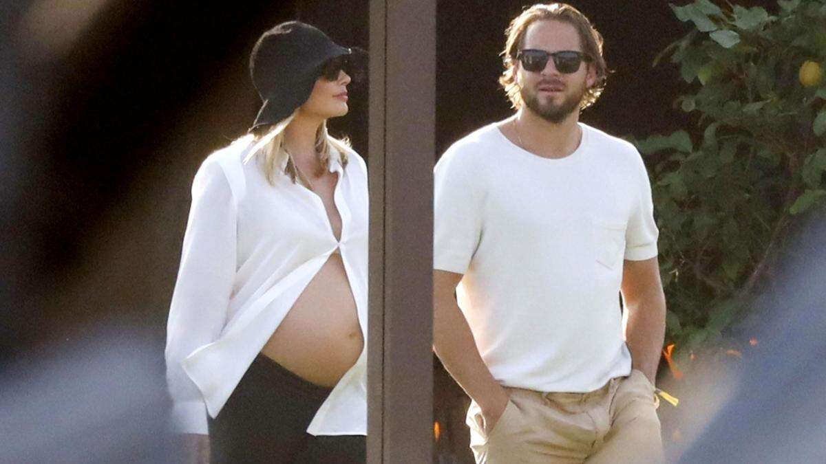 Heavily pregnant Margot Robbie shows off bare baby bump