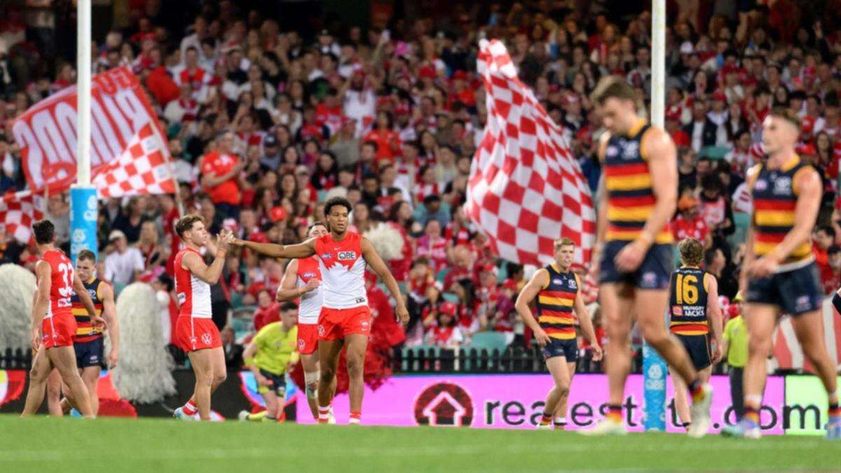 Swans rout Crows to clinch AFL minor premiership