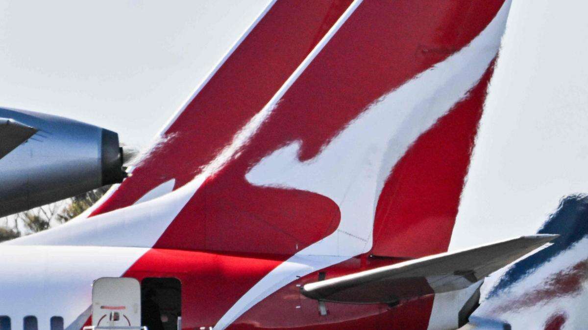 Qantas takes major hit to profits