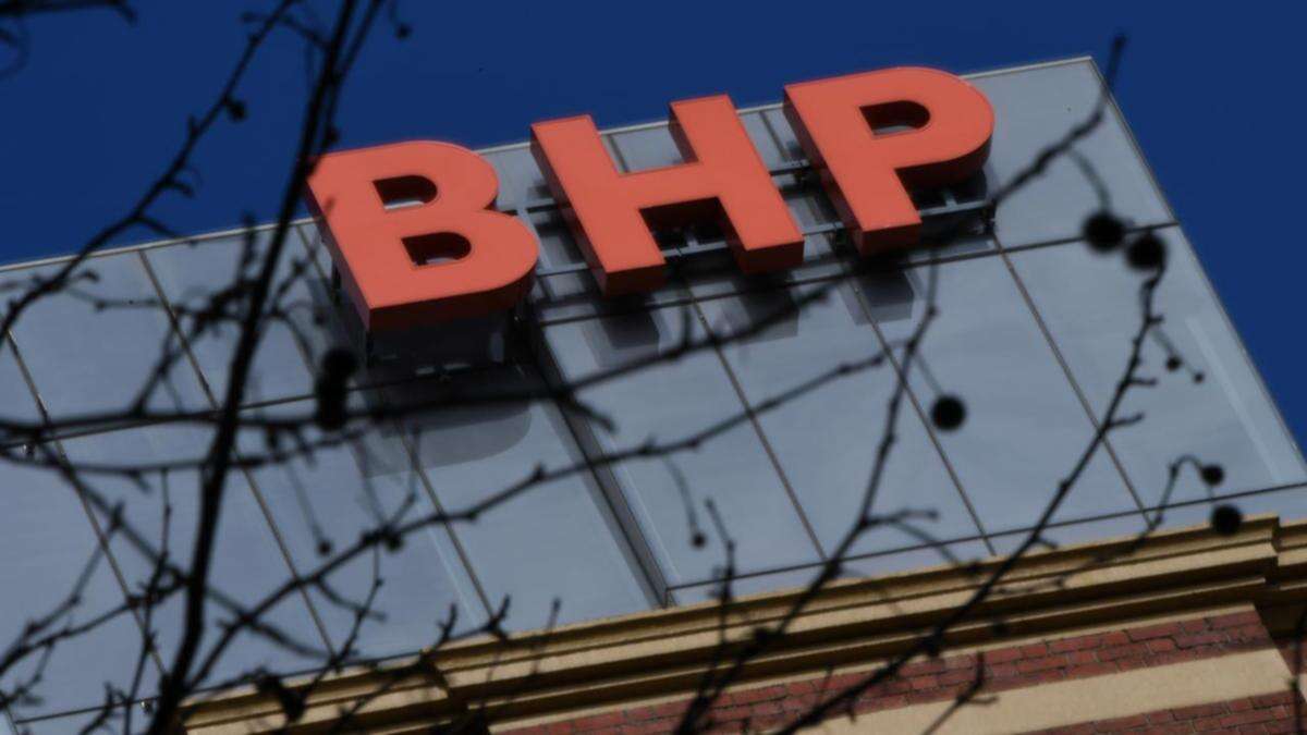 BHP full-year net profit slumps on writedowns, charges