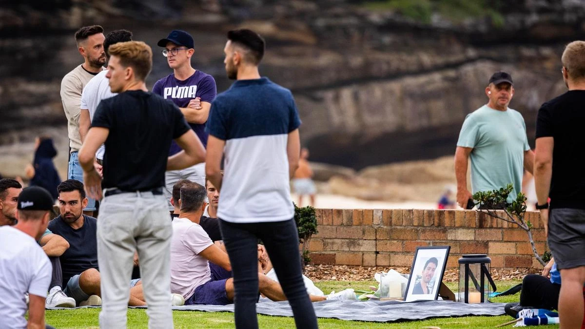 Friends hold vigil for murder victim