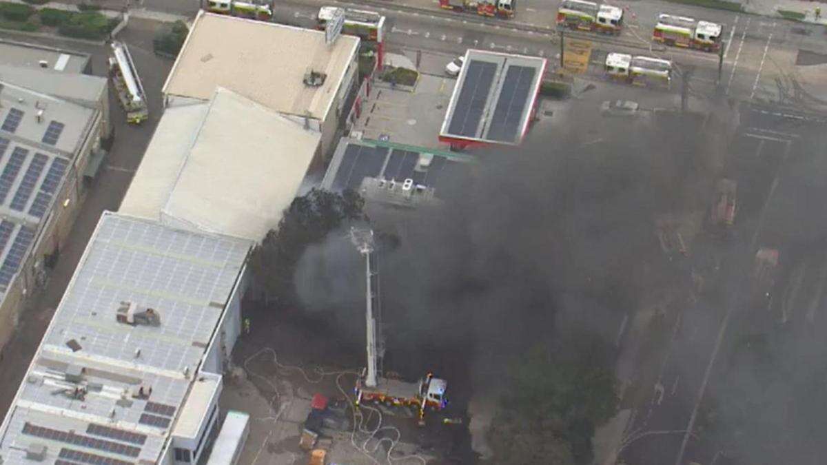 Massive industrial fire burning over city