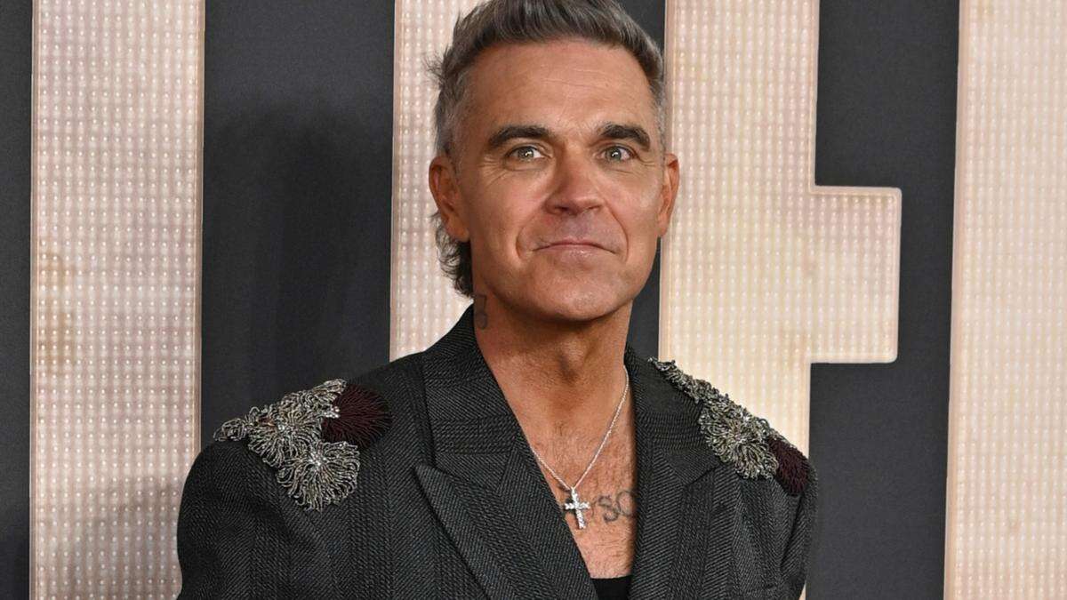 Robbie Williams admits he was a 'd***' to Madonna