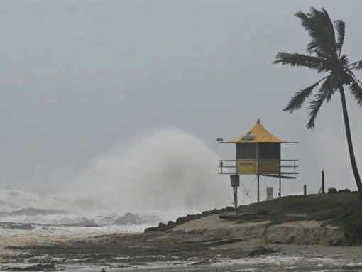Cyclone downgraded but dangerous weather threat looms