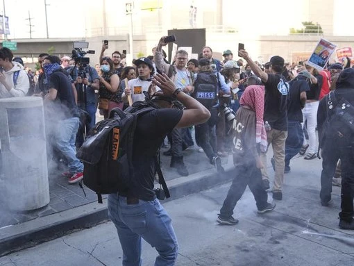 Cops, protesters face off in LA after immigration raids